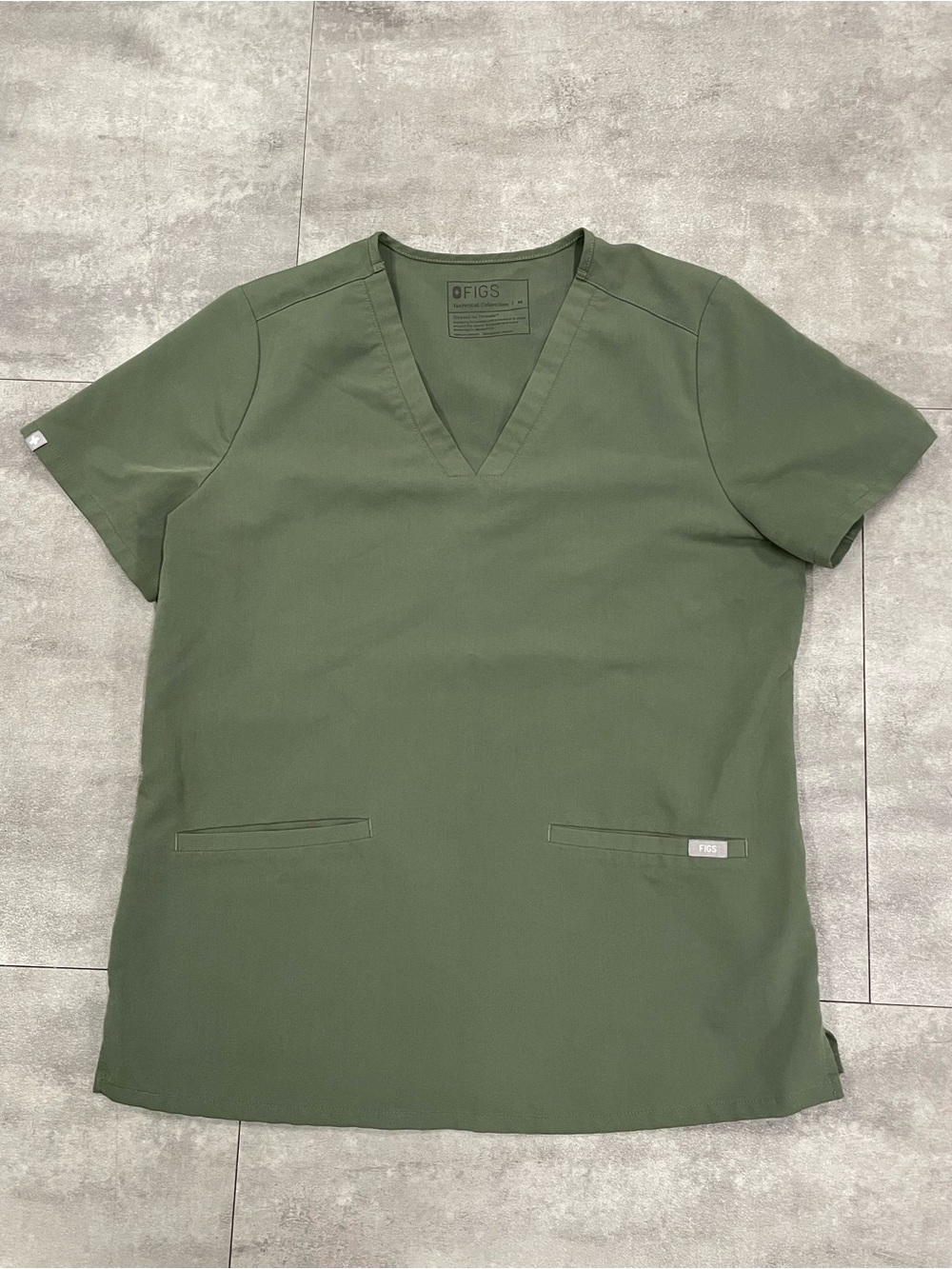 Size medium figs, Casma scrub top in moss green